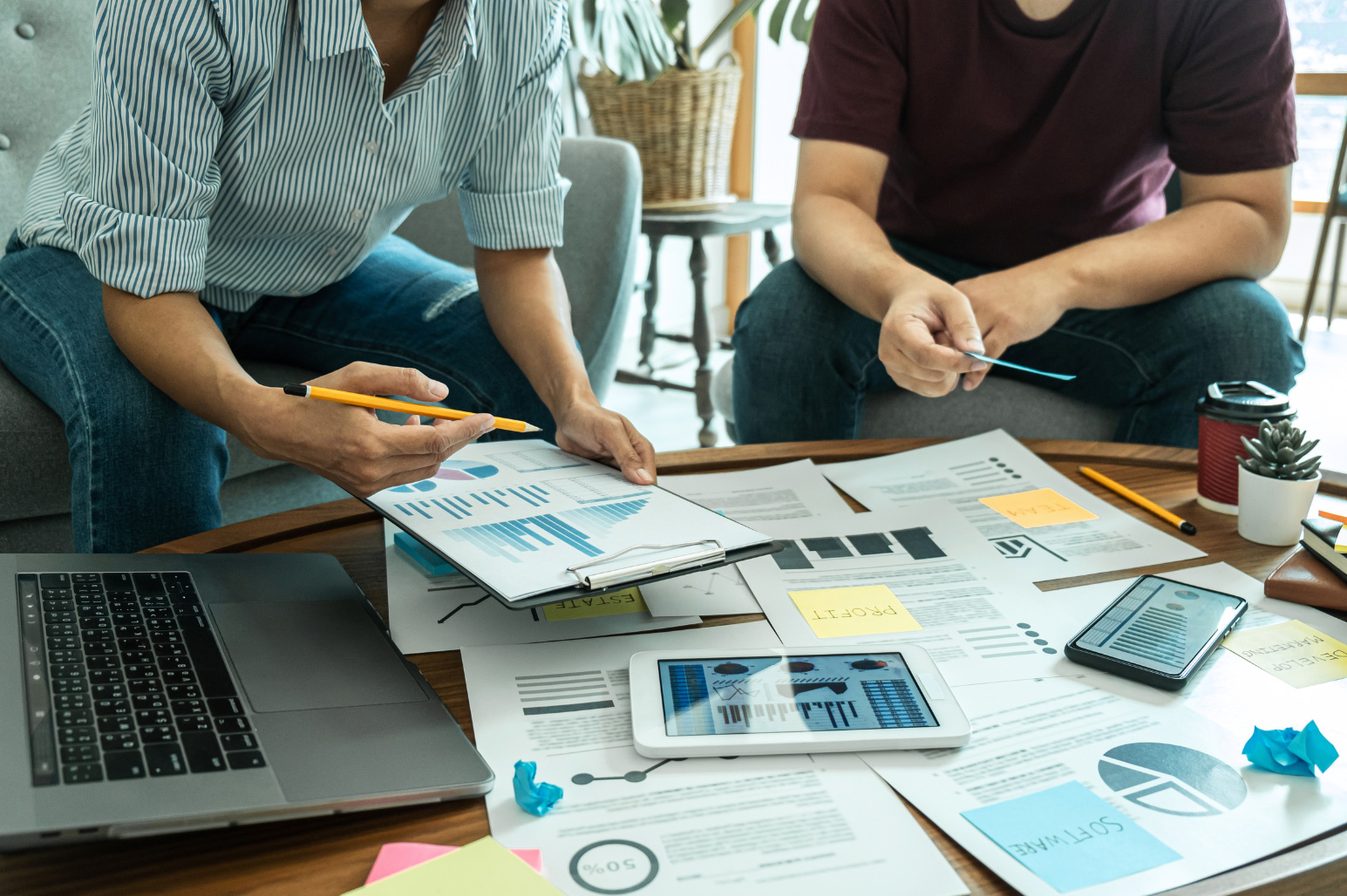 people with business planning documents on a table
